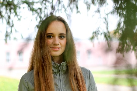 young woman portrait in autumn colorの写真素材