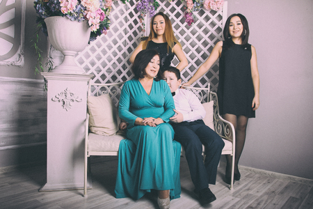 Mature mother in evening dress and her childrenの写真素材