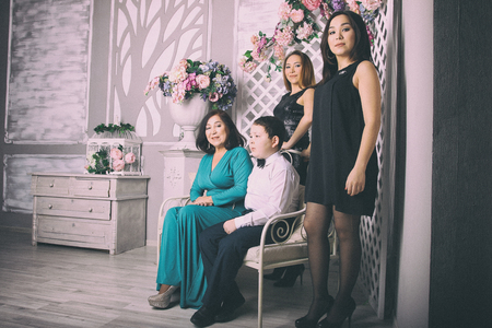 Mature mother in evening dress and her childrenの写真素材