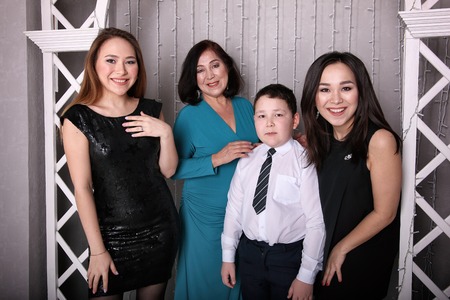 Mature mother in evening dress and her childrenの写真素材