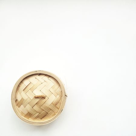 chinese bamboo basket isolated on white. photoの写真素材