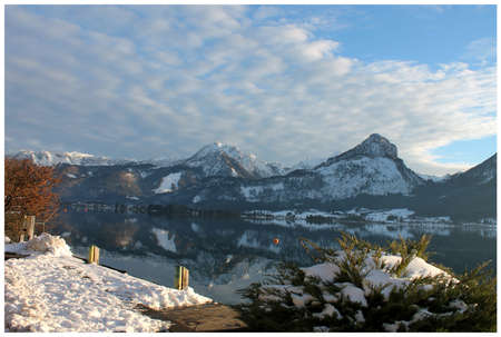 The majestic Alps are reflected in a mountain lakeの写真素材