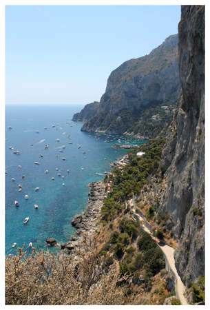 beautiful view of the rocks of the island of Capri and yachtsの写真素材