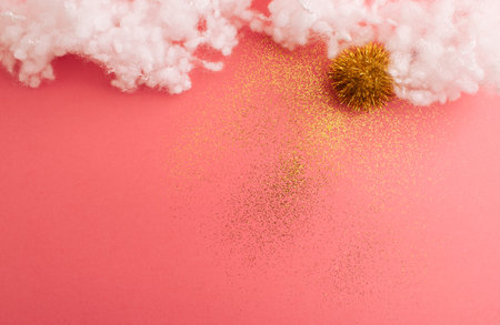 Sun in clouds - artistic presentation. Creative view on pastel pink backgorund. Flat lay.の写真素材