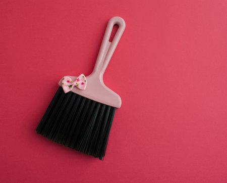 Pink brush with bowtie. Pastel background. Flat lay.の写真素材