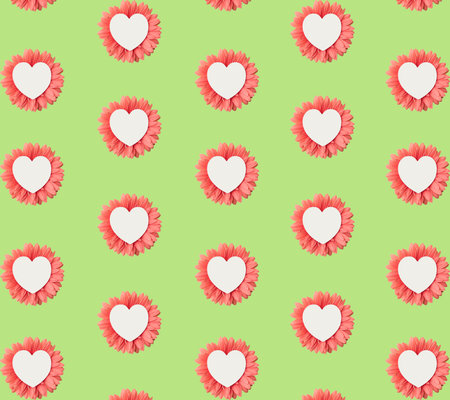 Pattern of white heart in beautiful pink flower on green backgroundの写真素材