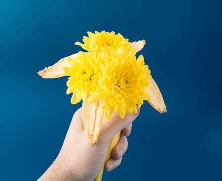 Bouquet of yellow flowers come from banana. Creative idea for spring and summer.の写真素材
