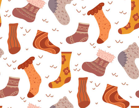 Vector seamless pattern with warm socks in brown colors with doodle decorations on white backdrop....
