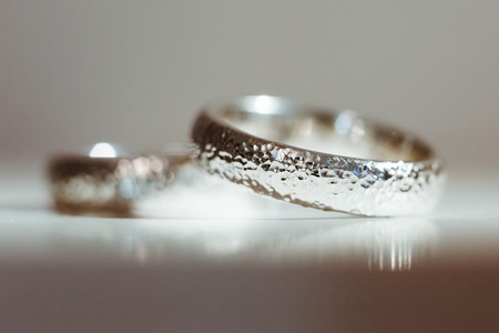 Pre-wedding preparation. Silver wedding rings for weds. Closeup, no peopleの写真素材