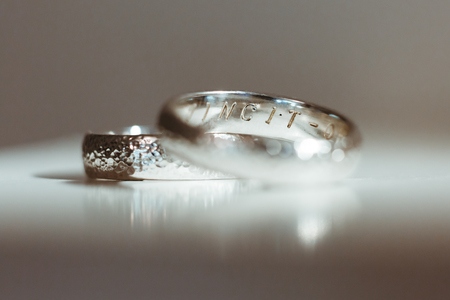 Pre-wedding preparation. Two silver wedding rings for weds. Closeup, no peopleの写真素材