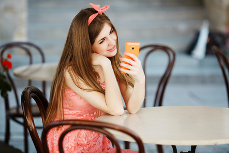 girl looking at mobile phoneの写真素材