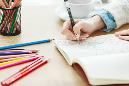 Womans hands with white manicure drawingの写真素材