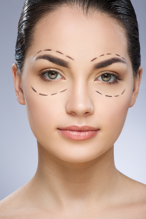 Beauty portrait of model with dashed lines around eyesの写真素材