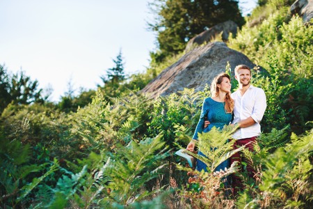 Happy couple among treesの写真素材