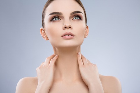 Beautiful girl with nude make up at studio