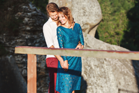 Nice couple at wooden bridgeの写真素材
