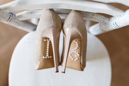 Shoes standing on chairの写真素材