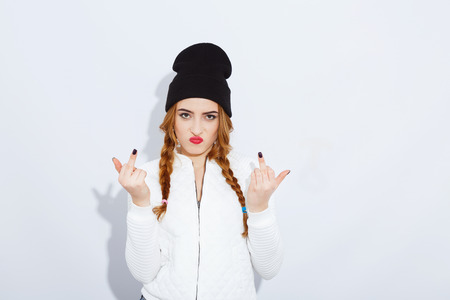 Cute teenage girl posing on white backgroundの写真素材