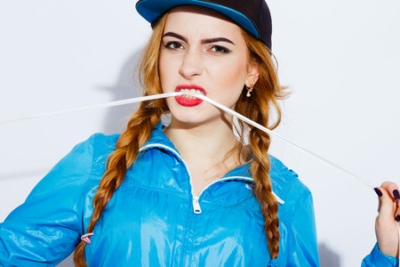 Cute teenage girl posing on white backgroundの写真素材