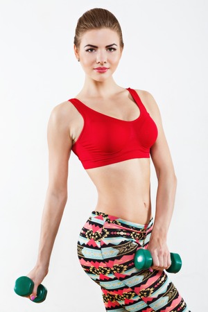 Sportive girl doing physical exercisesの写真素材