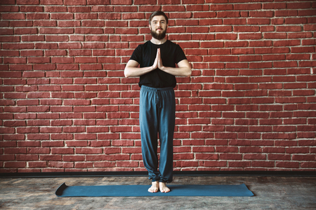 Yoga positions at wall backgroundの写真素材