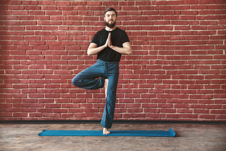 Young man practice yogaの写真素材