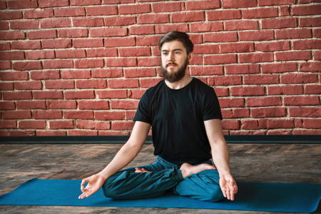 Young man practice yogaの写真素材