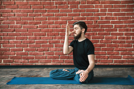 Young man practice yogaの写真素材
