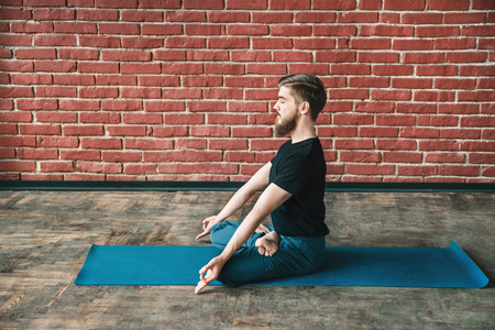 Young man practice yogaの写真素材