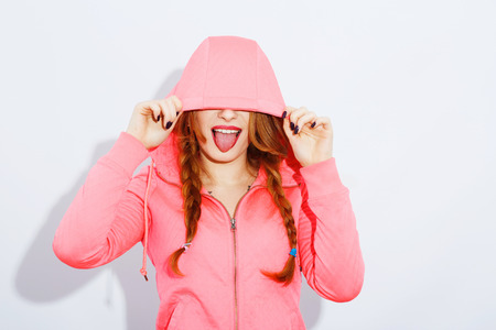 Cute teenage girl posing on white background