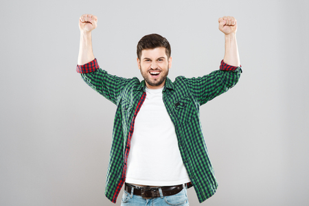 Cheerful man in green checked shirtの写真素材