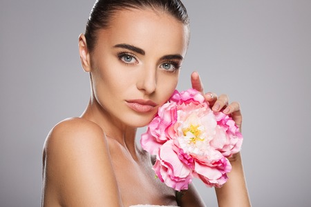 Model with big pink flowerの写真素材