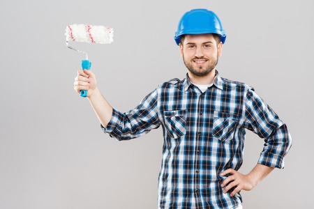 Man holding brush for painting wallsの写真素材