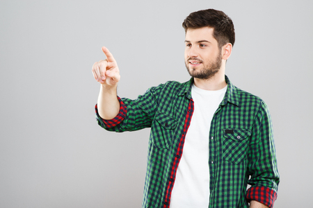 Boy in green and red checkered t-shirtの写真素材