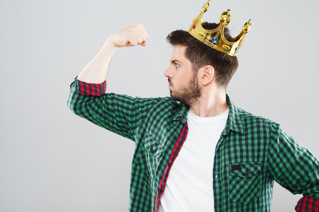 Man in crown showing strength