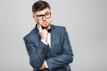 Thoughtful man in glassesの写真素材