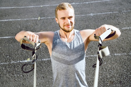 Attractive fit man posing in sport clothes