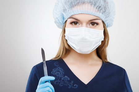 Beautiful nurse in blue medical uniformの写真素材