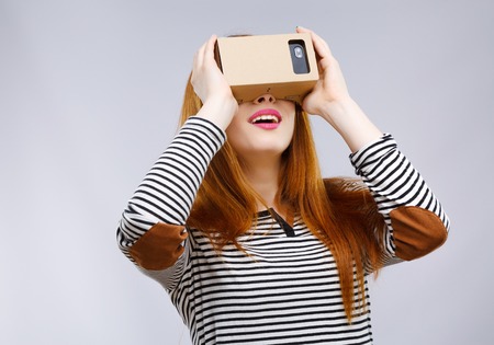 Girl looking at Virtual Reality Glassesの写真素材