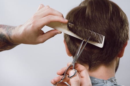 Barber doing a haircut