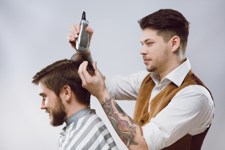Barber doing a haircutの写真素材