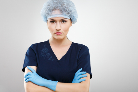 Beautiful nurse in blue medical uniformの写真素材