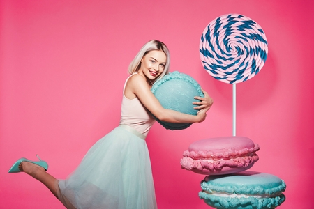 Attractive model with sweetsの写真素材