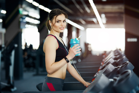 Fit girl with red short hair in gymの写真素材