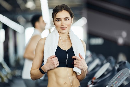 Fit girl with red short hair in gymの写真素材