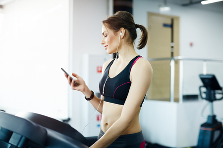 Cute girl exercising in gymの写真素材