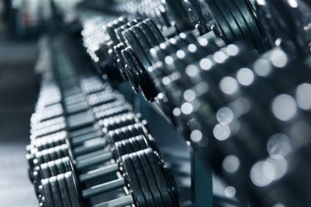 Close up photo of dumbbells in gym, portrait, sport concept, healthy lifestyle, gym concept.の写真素材