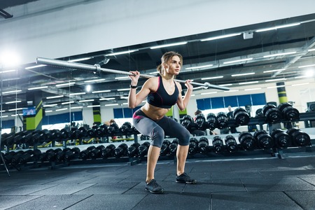 Cute girl exercising in gymの写真素材