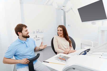 Dentist with satisfied patientの写真素材