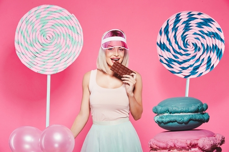 Attractive model with sweetsの写真素材
